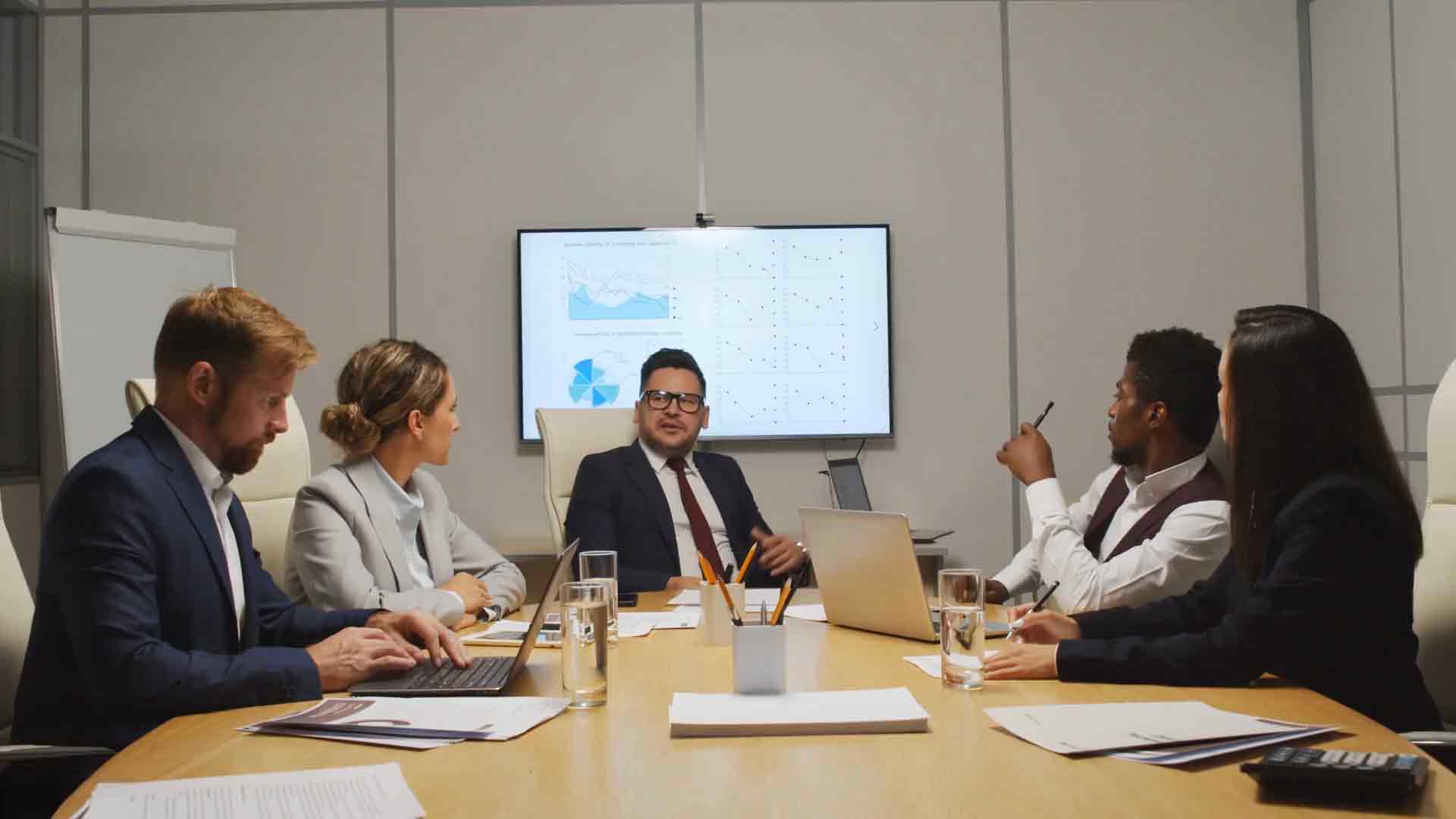 Instructor guiding attendees through custom visual development in Power BI, with code snippets and visual examples displayed.